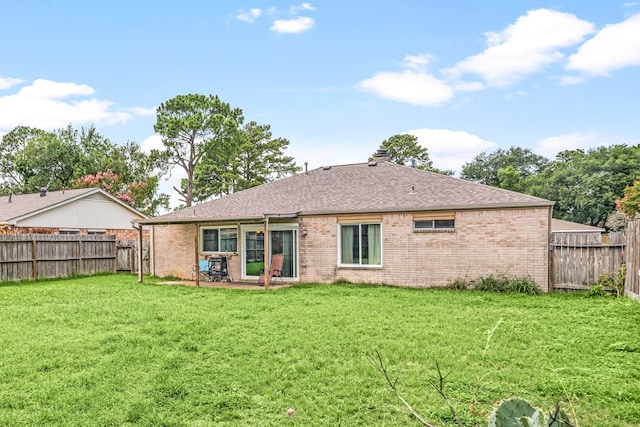 735 Red Rock Canyon Dr, Katy, TX 77450 - back of property with brick siding, a fenced backyard, and a shingled roof