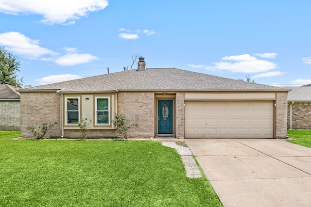 735 Red Rock Canyon Dr, Katy, TX 77450 - single story home with concrete driveway, brick siding, and a front lawn