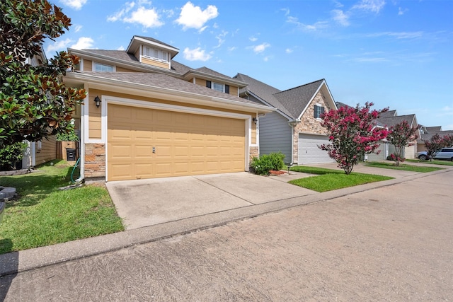 6439 Wilshire Rdg, Houston, TX 77040 - view of front facade featuring concrete driveway, roof with shingles, stone siding, a garage, and a front yard