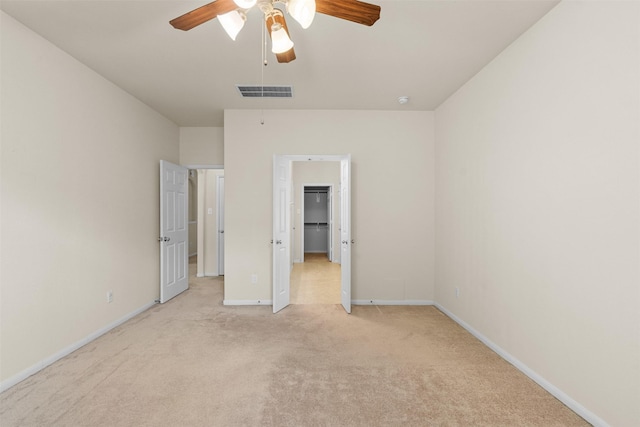 6439 Wilshire Rdg, Houston, TX 77040 - unfurnished bedroom with light carpet, a spacious closet, and a ceiling fan