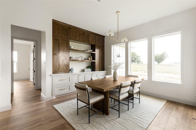 1355 Bluebonnet Ridge Dr, Chappell Hill, TX 77426 - dining space featuring light wood-style floors and baseboards