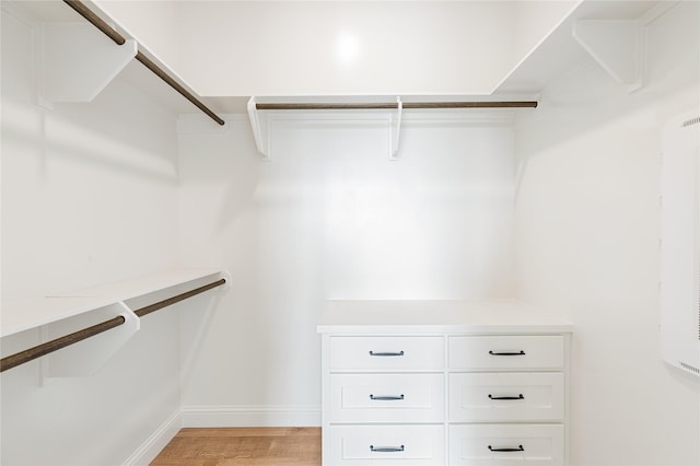 1355 Bluebonnet Ridge Dr, Chappell Hill, TX 77426 - walk in closet with light wood-style floors
