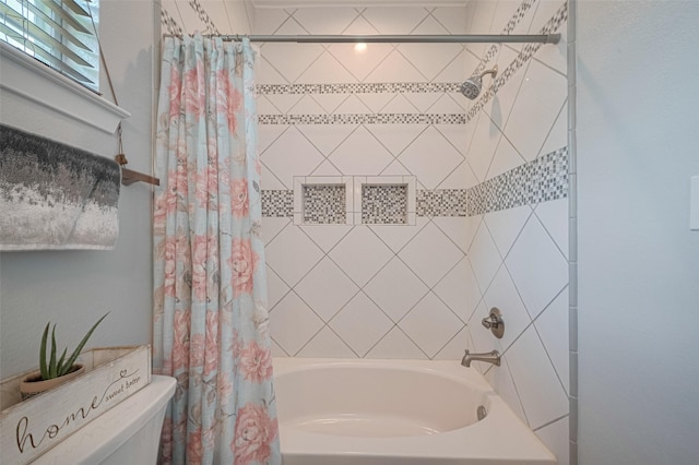 8705 W 1st St, Needville, TX 77461 - bathroom featuring shower / bath combo and toilet