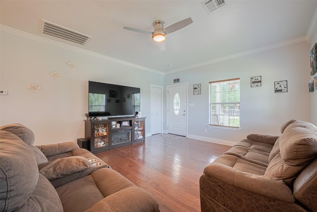 8705 W 1st St, Needville, TX 77461 - living room with ornamental molding, a ceiling fan, and wood finished floors