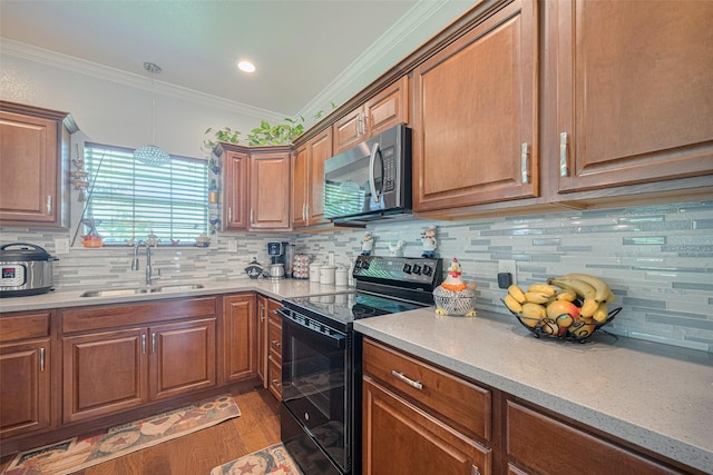 8705 W 1st St, Needville, TX 77461 - kitchen featuring electric range, stainless steel microwave, light wood-type flooring, decorative backsplash, and ornamental molding