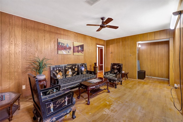 4007 Wedgewood St, Houston, TX 77093 - living area featuring ceiling fan, wood finished floors, and wooden walls