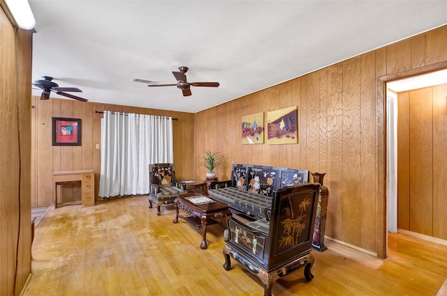 4007 Wedgewood St, Houston, TX 77093 - living area with a ceiling fan, wood finished floors, and wood walls