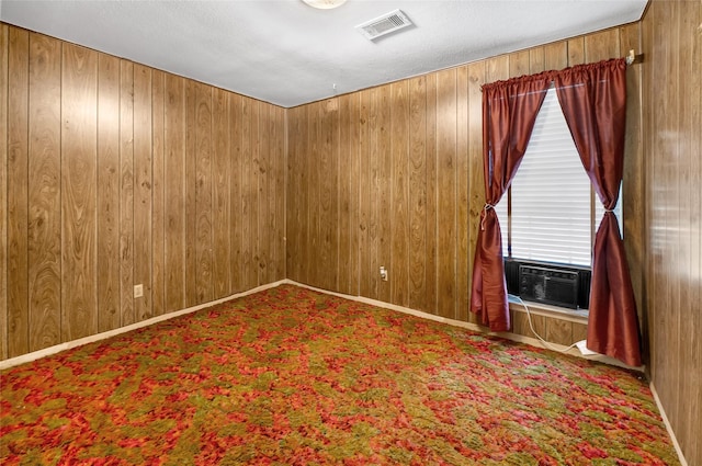 4007 Wedgewood St, Houston, TX 77093 - empty room with cooling unit, wooden walls, and carpet
