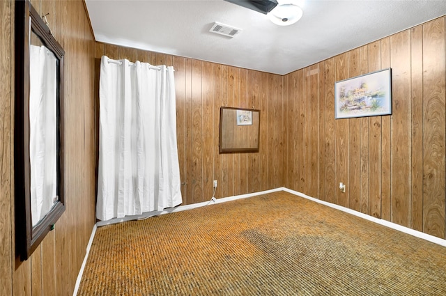 4007 Wedgewood St, Houston, TX 77093 - carpeted spare room featuring wooden walls and baseboards