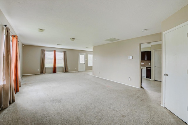 11303 Canyon Shore Dr, Humble, TX 77396 - spare room with light colored carpet and a smoke detector
