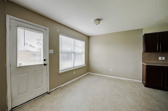 11303 Canyon Shore Dr, Humble, TX 77396 - unfurnished dining area with baseboards