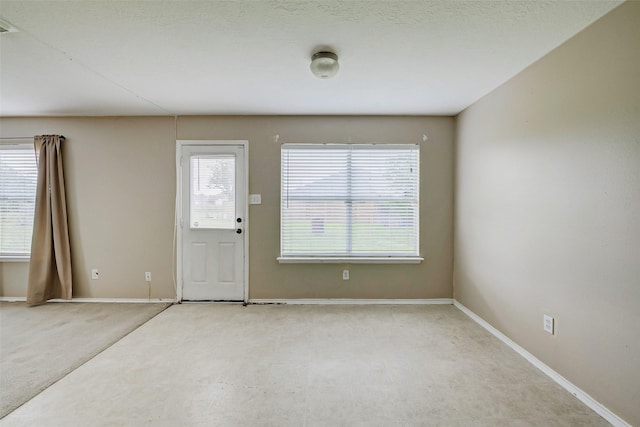 11303 Canyon Shore Dr, Humble, TX 77396 - carpeted entrance foyer with baseboards
