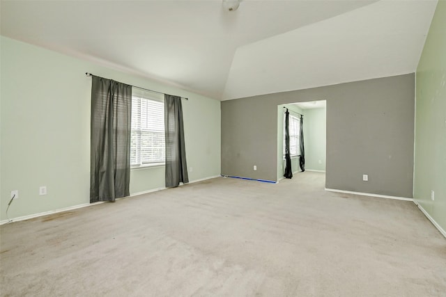 11303 Canyon Shore Dr, Humble, TX 77396 - unfurnished room featuring vaulted ceiling and light colored carpet