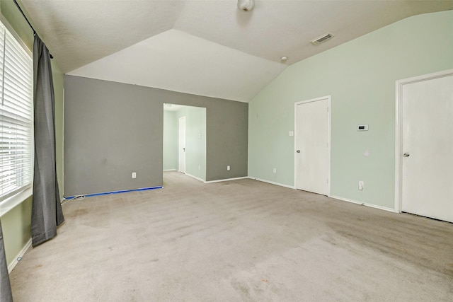11303 Canyon Shore Dr, Humble, TX 77396 - spare room featuring lofted ceiling and carpet flooring