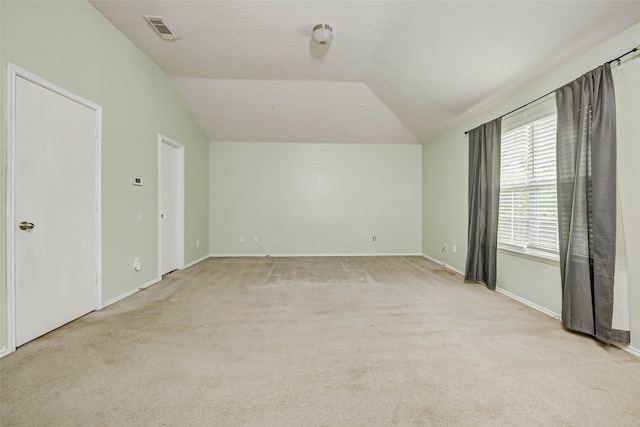 11303 Canyon Shore Dr, Humble, TX 77396 - spare room with lofted ceiling and light carpet