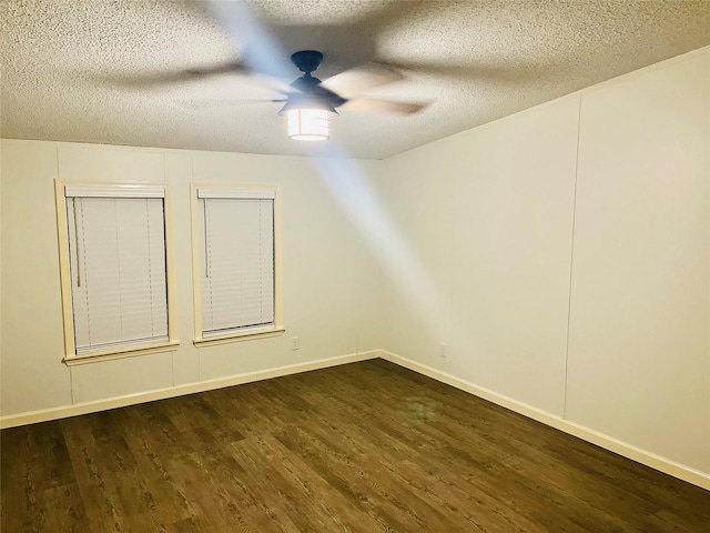 17909 Pine St Unit A, Crosby, TX 77532 - unfurnished room with a ceiling fan, dark wood-style floors, and a textured ceiling