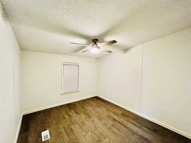17909 Pine St Unit A, Crosby, TX 77532 - spare room featuring dark wood-style flooring, a ceiling fan, and a textured ceiling