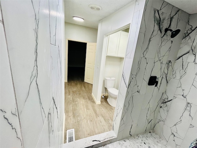 17909 Pine St Unit A, Crosby, TX 77532 - full bath with a marble finish shower and wood finished floors