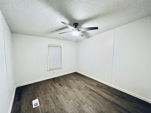 17909 Pine St Unit A, Crosby, TX 77532 - empty room with dark wood finished floors, ceiling fan, and a textured ceiling