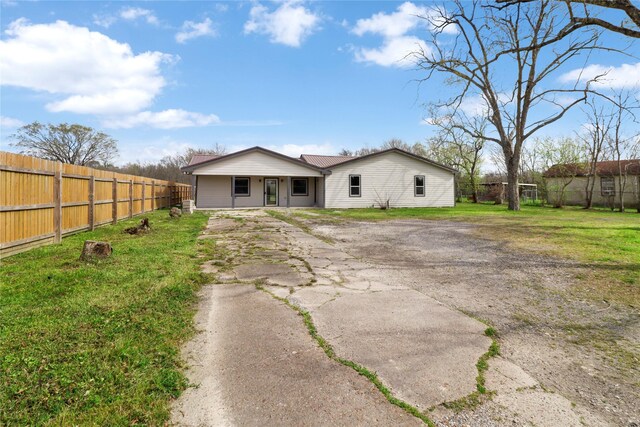 3406 W Cedar Bayou Lynchburg Rd, Baytown, TX 77521 - back of house featuring covered porch and asphalt driveway
