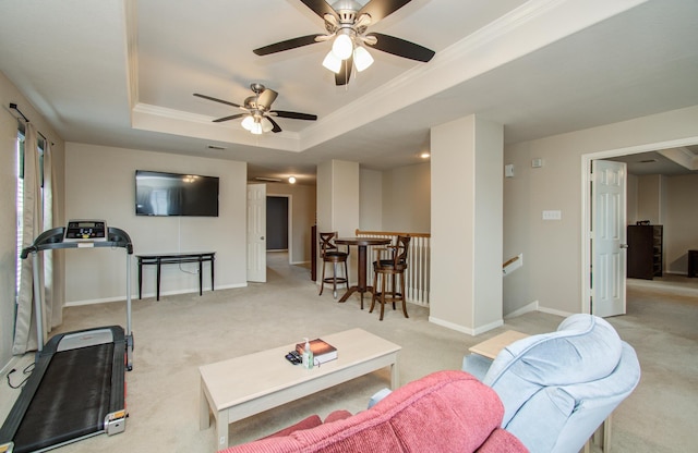 21522 Amesbury Meadow Ln, Spring, TX 77379 - carpeted living room with a tray ceiling, ceiling fan, and ornamental molding