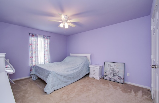 21522 Amesbury Meadow Ln, Spring, TX 77379 - carpeted bedroom with baseboards and a ceiling fan