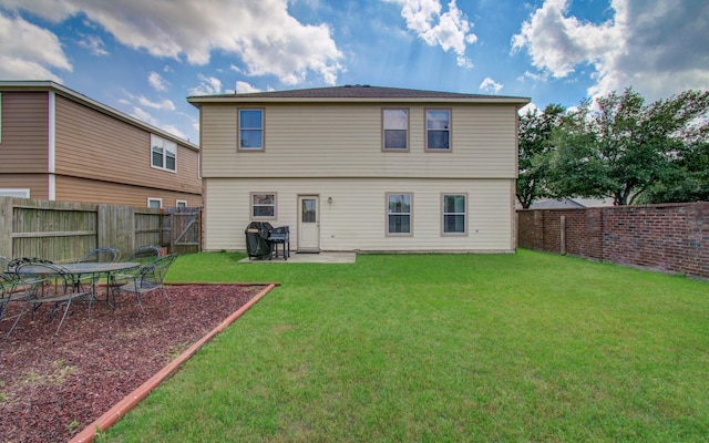 21522 Amesbury Meadow Ln, Spring, TX 77379 - back of house with a fenced backyard and a patio area