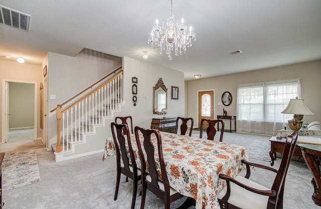 21522 Amesbury Meadow Ln, Spring, TX 77379 - dining area with light carpet, stairs, and a chandelier