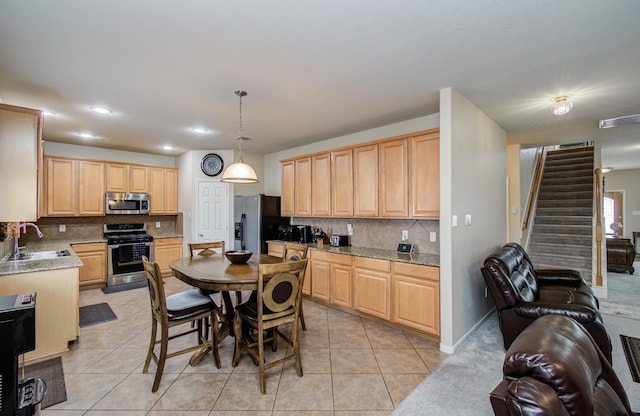 21522 Amesbury Meadow Ln, Spring, TX 77379 - kitchen featuring appliances with stainless steel finishes, backsplash, light brown cabinets, light tile patterned flooring, and recessed lighting