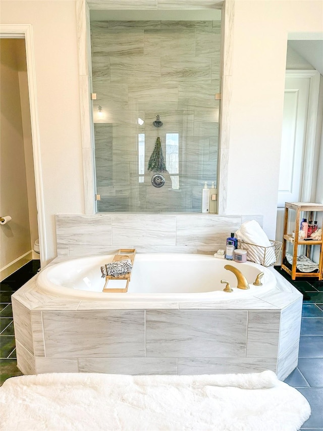 18923 Toscana Ln, New Caney, TX 77357 - full bath featuring a bath, tile patterned flooring, and a tile shower