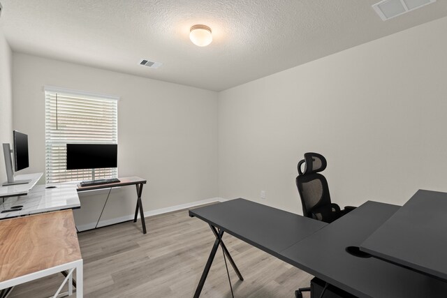 10433 Russell Pines Dr, Rosharon, TX 77583 - office featuring light wood finished floors and a textured ceiling