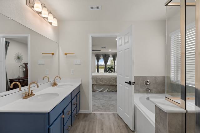 10433 Russell Pines Dr, Rosharon, TX 77583 - full bath featuring ensuite bathroom, wood finished floors, double vanity, and a bath