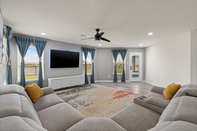 10433 Russell Pines Dr, Rosharon, TX 77583 - living room with recessed lighting, light wood-style floors, and a ceiling fan