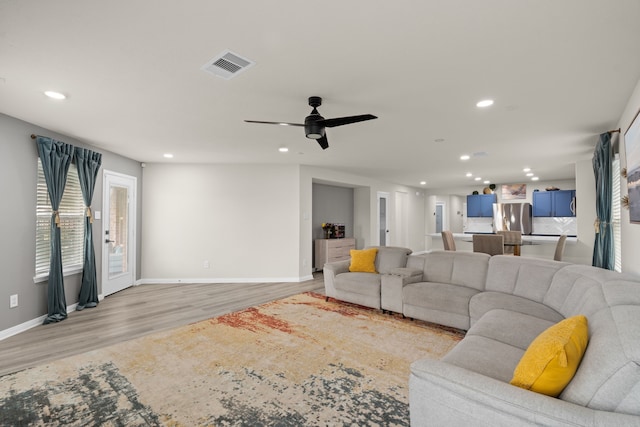 10433 Russell Pines Dr, Rosharon, TX 77583 - living room with recessed lighting, light wood finished floors, and ceiling fan