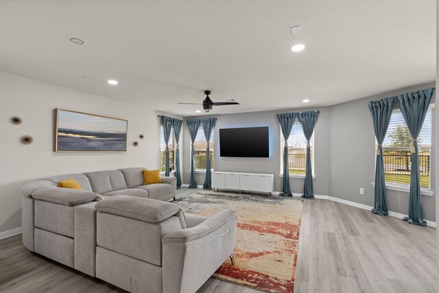 10433 Russell Pines Dr, Rosharon, TX 77583 - living area featuring wood finished floors, recessed lighting, plenty of natural light, and ceiling fan