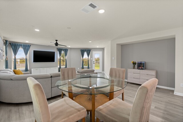 10433 Russell Pines Dr, Rosharon, TX 77583 - dining room featuring light wood finished floors, plenty of natural light, a ceiling fan, and recessed lighting