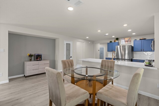 10433 Russell Pines Dr, Rosharon, TX 77583 - dining area featuring recessed lighting and light wood-style floors