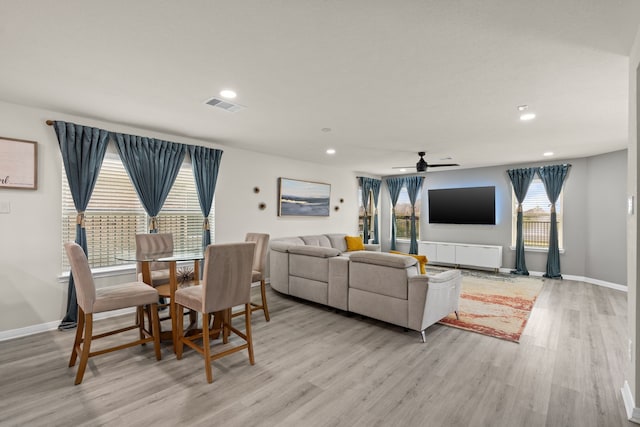 10433 Russell Pines Dr, Rosharon, TX 77583 - dining area with light wood-style floors, ceiling fan, and recessed lighting