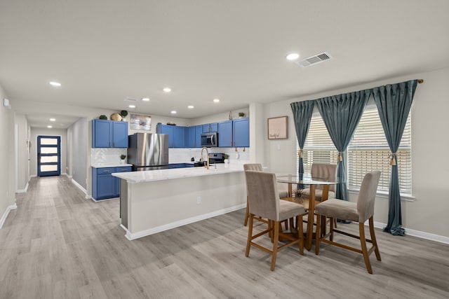 10433 Russell Pines Dr, Rosharon, TX 77583 - dining space featuring light wood-style floors and recessed lighting