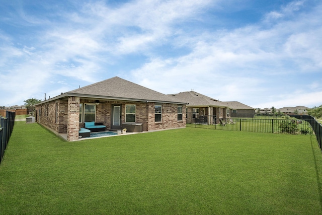 10433 Russell Pines Dr, Rosharon, TX 77583 - back of property with a fenced backyard, ceiling fan, outdoor lounge area, and brick siding