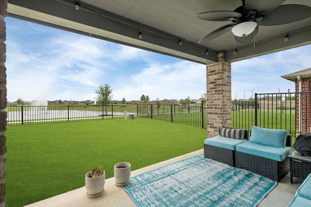10433 Russell Pines Dr, Rosharon, TX 77583 - fenced backyard with a water view, a ceiling fan, and outdoor lounge area