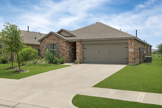10433 Russell Pines Dr, Rosharon, TX 77583 - ranch-style home featuring brick siding, roof with shingles, driveway, and an attached garage