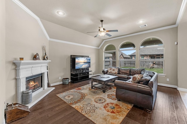 5622 Chipstone Trail Ln, Katy, TX 77493 - living room featuring a lit fireplace, wood finished floors, crown molding, vaulted ceiling, and a ceiling fan