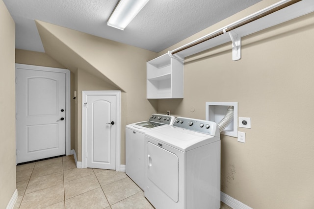 5622 Chipstone Trail Ln, Katy, TX 77493 - washroom with separate washer and dryer, a textured ceiling, and light tile patterned flooring