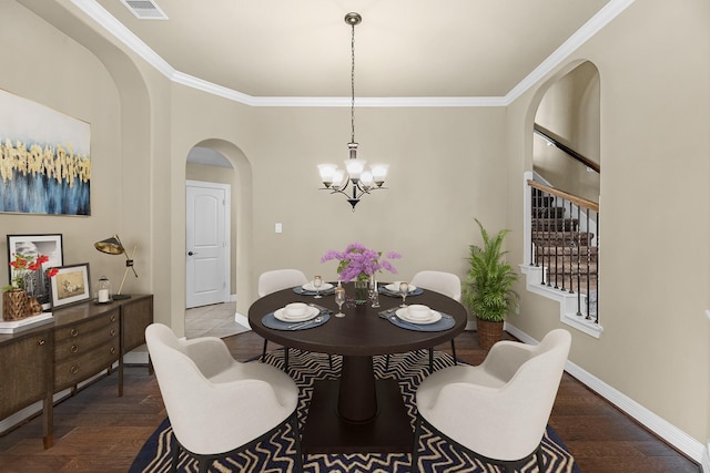 5622 Chipstone Trail Ln, Katy, TX 77493 - dining area featuring arched walkways, crown molding, a chandelier, wood finished floors, and stairway