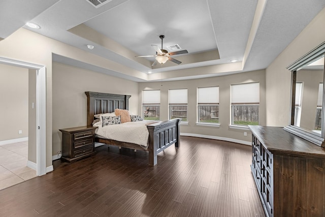 5622 Chipstone Trail Ln, Katy, TX 77493 - bedroom featuring a raised ceiling, wood finished floors, and a ceiling fan