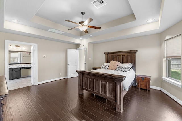 5622 Chipstone Trail Ln, Katy, TX 77493 - bedroom with a tray ceiling, wood finished floors, a ceiling fan, connected bathroom, and recessed lighting