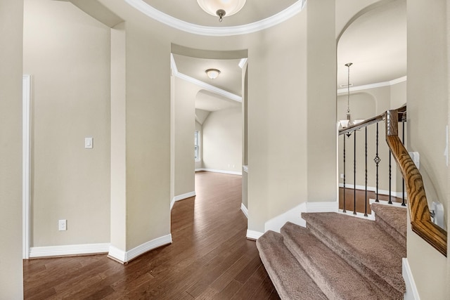 5622 Chipstone Trail Ln, Katy, TX 77493 - staircase with arched walkways, crown molding, and wood finished floors