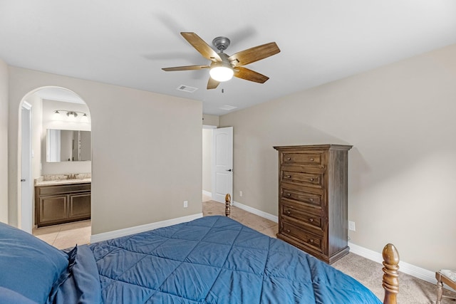 5622 Chipstone Trail Ln, Katy, TX 77493 - bedroom featuring a ceiling fan, arched walkways, and connected bathroom