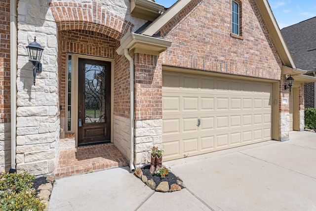 5622 Chipstone Trail Ln, Katy, TX 77493 - doorway to property with concrete driveway, brick siding, roof with shingles, and stone siding